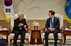 President Lee Jae Myung, right, meets with Cardinal Lazarus You Heung-sik at the presidential office in central Seoul on July 7. [JOINT PRESS CORPS]