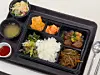 A vegan meal sold at Yonsei University's Bureulsaem Cafeteria on April 11, featuring bibimbap, patties using plant-based meat, miso soup, braised tofu, japchae (stir-fried glass noodles) and salad. [LEE TAE-HEE]