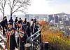 Participants of the 2025 Seoul Eco Hiking Festa take in the city view as they hike along a trail on Mount Namsan in Jung District, central Seoul, on Nov. 15. [PARK SANG-MOON]