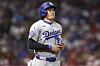 Los Angeles Dodgers designated hitter Shohei Ohtani runs towards first base after being walked during the sixth inning of a baseball game against the Los Angeles Angels, on Aug. 11, in Anaheim, California. [AP/YONHAP]