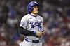 Los Angeles Dodgers designated hitter Shohei Ohtani runs towards first base after being walked during the sixth inning of a baseball game against the Los Angeles Angels, on Aug. 11, in Anaheim, California. [AP/YONHAP]
