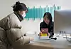 An employee demonstrates how to use the value-added tax refund device at Mili Clinic in Gangnm District, southern Seoul, on Dec. 12. [PARK SANG-MOON]