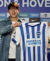 Yun Do-young poses with a Brighton & Hove Albion jersey in England in a photo shared on the club's official X account on March 21. [SCREEN CAPTURE]