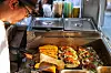 Owner Kim Hang-keun makes tacos at Oldies Taco in Jongno District, central Seoul [JOONGANG PHOTOS]