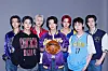 Enhypen members pose for a photo with merchandise from NBA teams [NBA]
