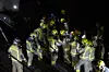 Generalitat's firemen work at the place where a train crashed with a collapsed wall which fell to the via at Gelida city in Barcelona, Spain, on Jan. 20. [EPA/YONHAP]