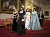 Members of K-pop girl group Blackpink head into the state banquet at Buckingham Palace in London Tuesday, celebrating the state visit to Britain by President Yoon Suk Yeol. [AP/YONHAP]