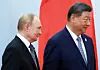 Russian President Vladimir Putin, left, and Chinese President Xi Jinping take part in a photo ceremony at the Shanghai Cooperation Organisation summit in Tianjin on Sept. 1. [REUTERS/YONHAP]