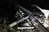 A Generalitat's fireman stands near the covered corpse at the place where a train crashed with a collapsed wall which fell to the via at Gelida city in Barcelona, Spain, on Jan. 20. [EPA/YONHAP]