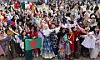 Foreign students in traditional dress gather for a photo during the “Ajou International Day” event at Ajou University in Suwon, Gyeonggi, on Nov. 6. [YONHAP]