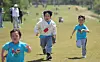 Children are seen running at a country club in Anyang, Gyeonggi, during a free open house on May 7. [NEWS1]