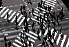 Office workers walk across a crosswalk in Jongno District, central Seoul, on Oct. 17, 2021. [YONHAP]