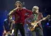 Mick Jagger, center, Ronnie Wood, left, and Mick Taylor, of British rock band The Rolling Stones, perform on the Pyramid main stage at Glastonbury, England, June 29, 2013. [AP/YONHAP]
