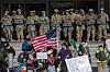 Demonstrators holding signs and flags face California National Guard members standing guard outside the Federal Building as they protest in response to federal immigration operations in Los Angeles on June 9. [AFP/YONHAP]