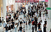 The duty-free shops at Terminal 1 of Incheon International Airport in Incheon are crowded with tourists on June 6. [NEWS1]