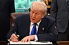 U.S. President Donald Trump signs executive orders in the Oval Office of the White House in Washington on May 5. [AFP/YONHAP]