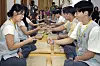 Participants of a dating program dubbed “Naneun Jeollo,' hosted by the Korean Buddhist Foundation for Social Welfare and the Ministry of Health and Welfare play rock, paper, scissors at Naksan Temple in Yangyang County, Gangwon, on Aug. 9. [PARK SANG-MOON]