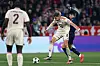 Paris Saint-Germain midfielder Lee Kang-in, right, fights for the ball with Bayern Munich midfielder Leon Goretzka during a Champions League math at Allianz Arena in Munich, Germany on Tuesday. [AFP/YONHAP]