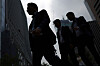 Pedestrians walk along the streets of Yeouido in western Seoul in June. [YONHAP]