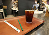 A plastic straw is placed next to a cup of coffee at a Starbucks branch in Seoul on June 26. [YONHAP]