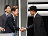 Lee Jae-myung of the Democratic Party, left, greets Kim Moon-soo of the People Power Party ahead of the second televised presidential debate at the KBS studio in Yeongdeungpo District, western Seoul, on May 23. [JOINT PRESS CORPS]
