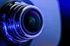 Illustration of camera lens with blue light [GETTY IMAGES BANK]