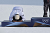 Snowboarder Kim Sang-kyum bows during the medal ceremony of the men’s parallel giant slalom event of the Milan-Cortina Winter Olympics at the Livigno Snow Park in Italy on Feb. 8. [KIM JONG-HO]