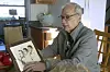 John Prevost points to an old photo of his brothers, including the newly elected Pope Leo XIV, Robert Prevost, left, during an interview with the Associated Press on May 8. [AP/YONHAP]