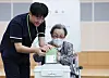 An older adult with mobility difficulties casts their ballot at a state-run nursery home in Suwon, Gyeonggi, on May 27. [NEWS1]