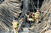 Firefighters work to locate possible survivors at the collapsed construction site of the City Main Library Gwangju in Gwangju on Dec. 11. [YONHAP]