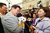 Democratic Party presidential candidate Lee Jae-myung greets a supporter's pet dog at a market in Gangjin County, South Jeolla, on May 11. [YONHAP]