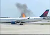 Flames rise from a Delta Air Lines airplane on April 21, at the Orlando International Airport, in Orlando in the United States. [AP/YONHAP]