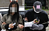 Two suspects accused of attempting to extort money from Tottenham Hotspur captain Son Heung-min appear at Seoul Central District Court in southern Seoul on May 17 for a detention warrant hearing. [YONHAP]