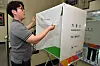 An election worker inspects a polling booth that will be used for early voting later this week in Pohang, North Gyeongsang, on May 27. [NEWS1]