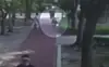 CCTV footage shows a woman walking her dog in an apartment complex in Gangseo District. The woman was injured after being struck on the head by a falling glass bottle. [SCREEN CAPTURE]