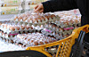 A customer buys eggs at a supermarket in Seoul on Jan. 6. [NEWS1]