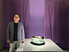 Kang Suk-keun poses alongside his award-winning piece, ″Language of the Earth,″ (2023) at the Seoul Museum of Craft Art in central Seoul on Monday. [SHIN MIN-HEE]