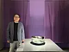 Kang Suk-keun poses alongside his award-winning piece, ″Language of the Earth,″ (2023) at the Seoul Museum of Craft Art in central Seoul on Monday. [SHIN MIN-HEE]