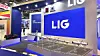 LIG Nex1 exhibition booth with a large blue logo, Korean flag and defense-system models on display.