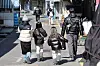 A family walks through central Seoul on Feb. 23. [YONHAP]