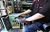 A cobbler surnamed Jo polishes a customer’s shoes in central Seoul on Sept. 1. [KANG JUNG-HYUN]