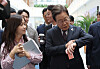 President Lee Jae-myung looks at his wristwatch while walking with reports to the presidential office in Yongsan District, central Seoul, on June 10. [JOINT PRESS CORPS]