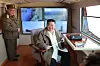 This image, captured from the Rodong Sinmun daily on March 21, shows North Korean leader Kim Jong-un smiling contentedly after a missile test. [YONHAP]