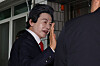 Huh Kyung-young, honorary leader of the National Revolutionary Party, answers questions from reporters before attending a court hearing on charges including fraud, violations of the Political Funds Act and quasi-forcible indecent assault at the Uijeongbu District Court in Ganeung-dong, Uijeongbu, Gyeonggi, on May 16. [YONHAP]