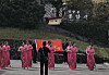 A group of women in traditional Chinese dress dance near Dongam Temple at Seongsan Ilchulbong on Jeju Island in this screenshot from a video footage uploaded to an online community. [SCREEN CAPTURE]