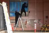 Workers repair damaged windows of the Seoul Western District Court in Mapo District on Jan. 20. [YONHAP]