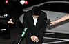 BTS member Suga bows his ahead to apologize for driving an electronic scooter under the influence at the Yongsan Police Station in central Seoul, where he arrived at around 7:45 p.m. to be questioned by policeon Aug. 23. [YONHAP]