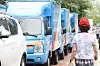 Delivery trucks are parked at a parcel terminal in Seoul on Aug. 14. [YONHAP]