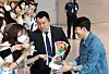 Tottenham Hotspurs captain Son Heung-min receives flowers and gifts from fans as he arrives at Incheon International Airport in the afternoon on May 27. [NEWS1]