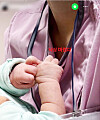 A photo posted to social media shows a nurse holding up a baby with a caption reading, ″I’m itching to let one fall.″ The post began circulating on Apr. 1. [SCREEN CAPTURE]